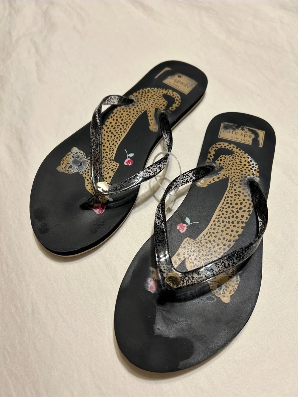 kate spade Black Leopard Print Flip Flop Sandals with Pink Floral Accent